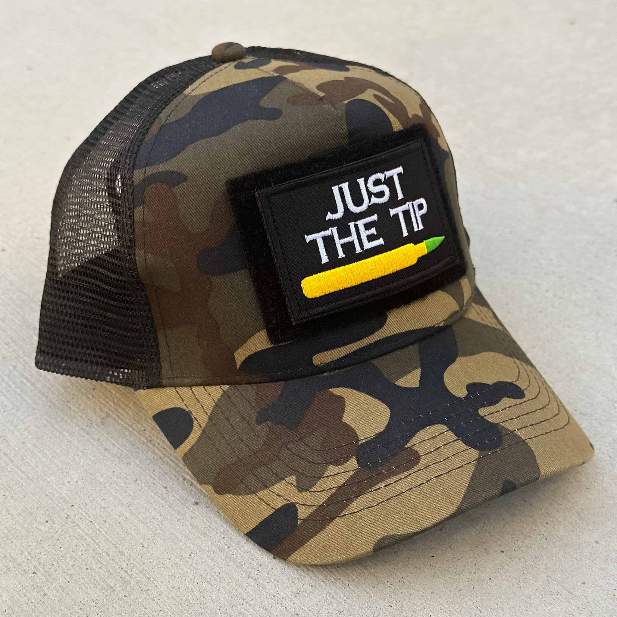 The Blank Canvas Snapback cap in camo color with the 'Just the Tip' patch attached